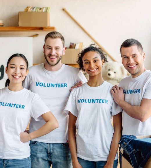 five-young-multicultural-volunteers-standing-together-smiling-and-looking-at-camera-e1657642113794.jpg